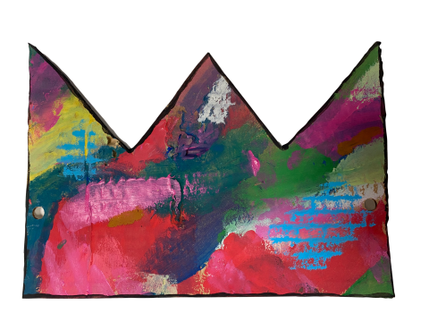 Image of a cardboard cut crown painted with swatches of bright colors. 