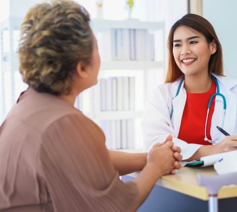 female patient talking with female doctor