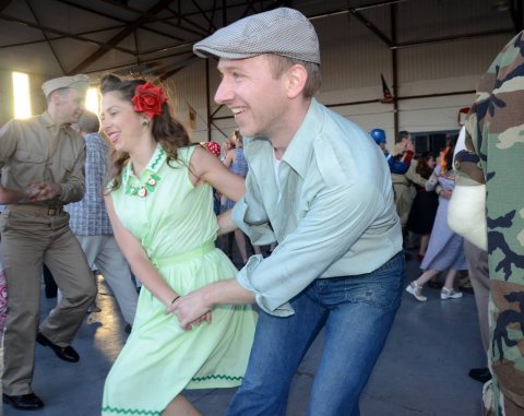 man and woman swing dancing