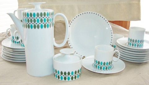 mid-century modern dish set that is white with turquoise and blue design