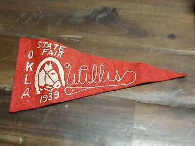 reddish orange okla state fair pennant from 1939, on wood-like background