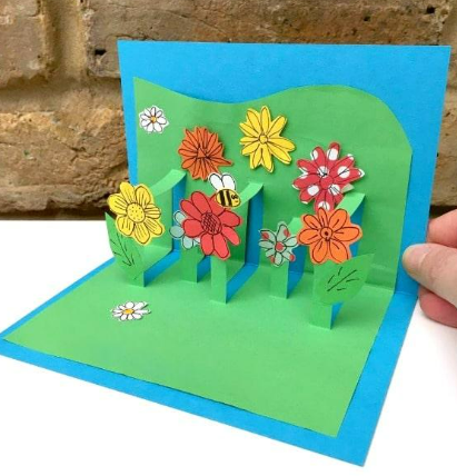 green popup card with yellow and orange flowers