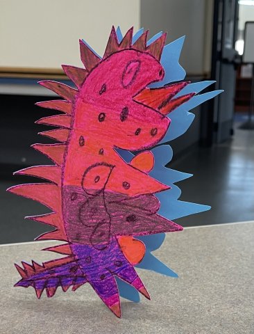 A magenta and blue animal that has spots it's an imaginary alebrije