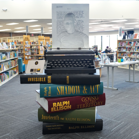 Ralph Ellison statue inside the Ralph Ellison Library.