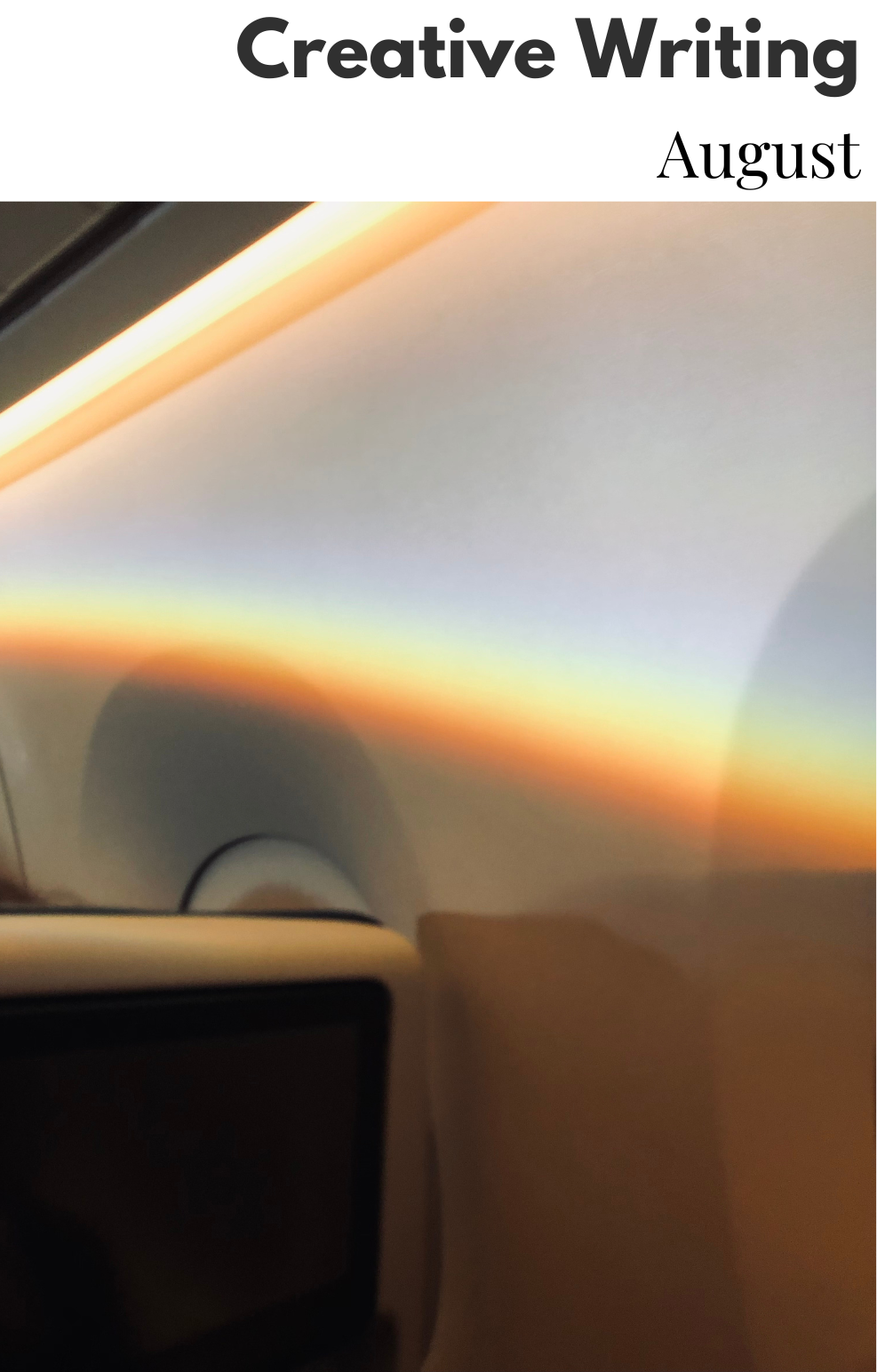 Image of colorful rainbow light shining against the wall of an airplane. 