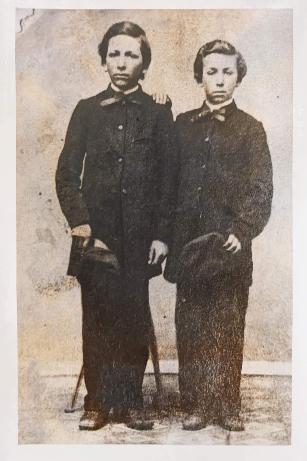 Photo from the 1800's of two young teen boys.